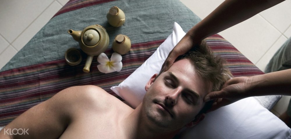 man receiving head massage