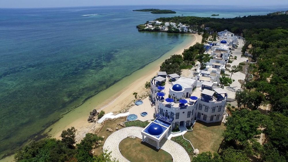 aerial shot of beach resort and ocean