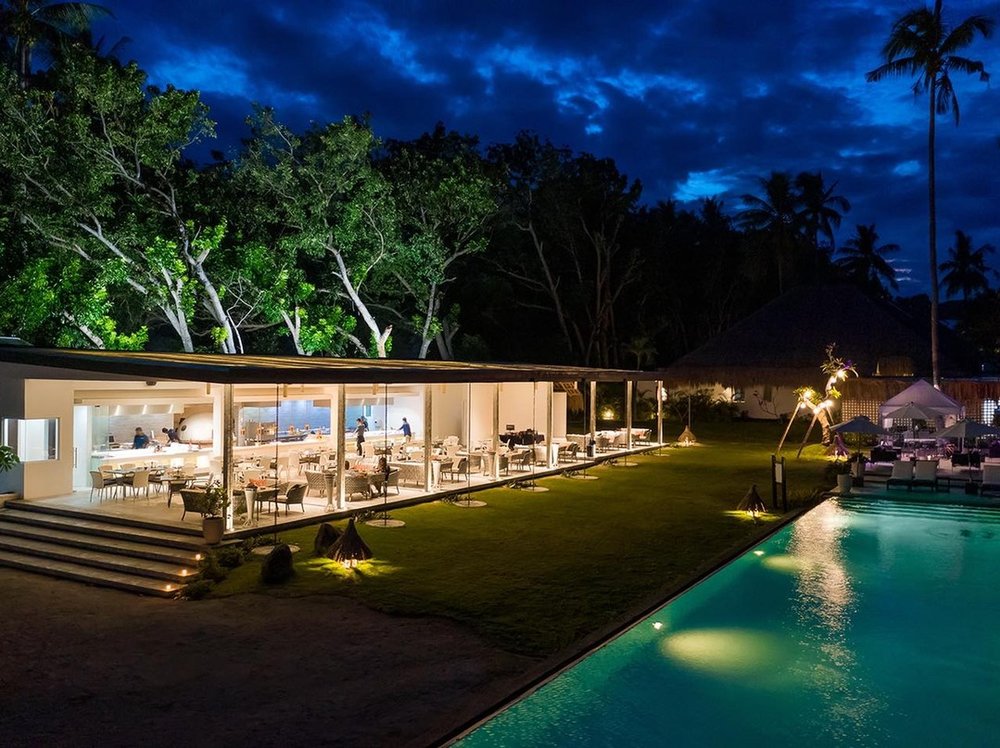 glass bungalow next to garden