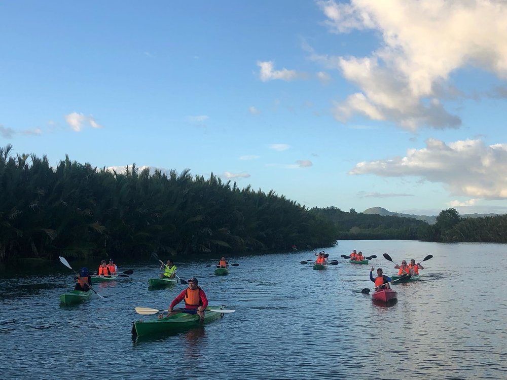 group of people kayaking in river