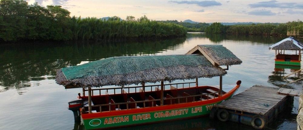 boat with nipa roof anchored in river