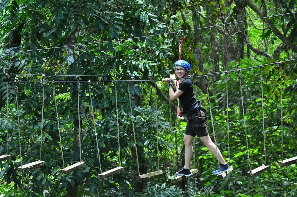 woman smiling while in obstacle course