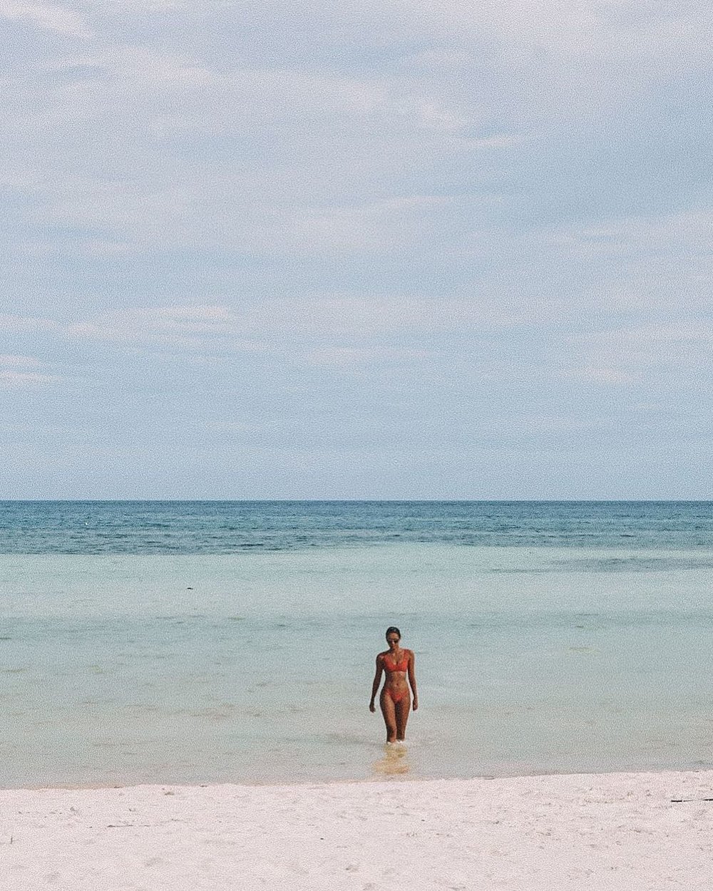 woman posing by the beach