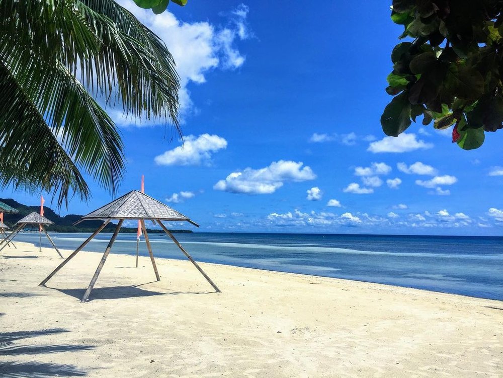white sand and blue skies