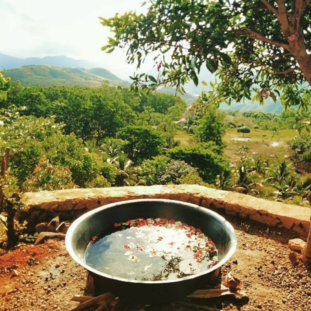 stone hot tub overlooking moutain view