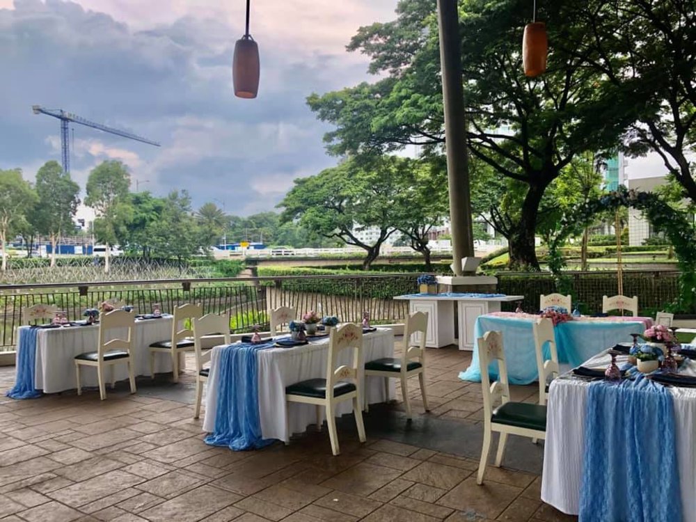 al fresco dining area by pond