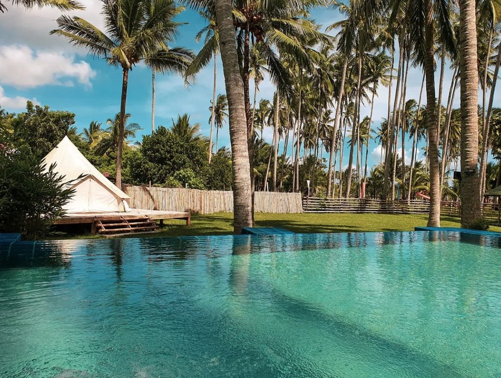 white tent infront of pool