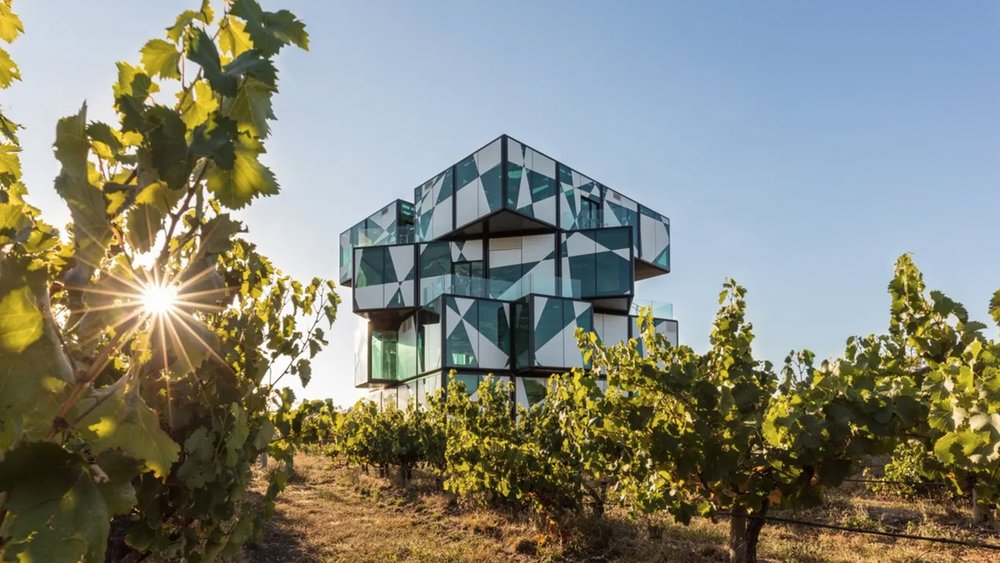 This five-story building looks as if it’s floating atop the stunning vineyard