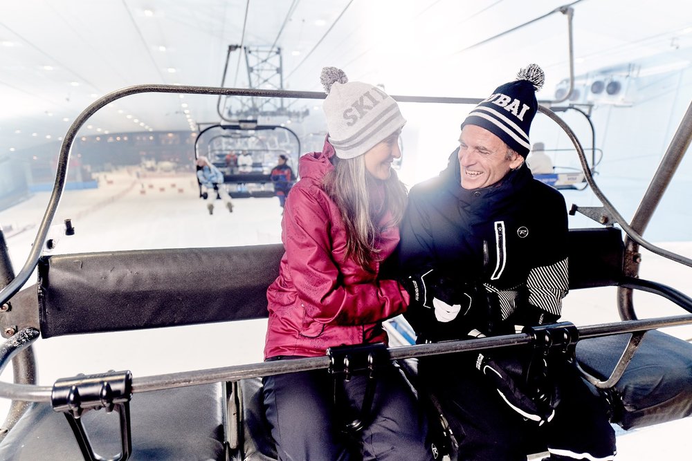 couple enjoying the view on chair lift at ski dubai