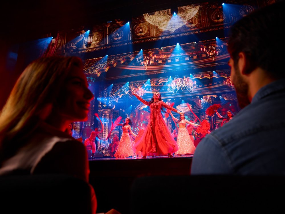 couple watching a performance at bollywood parks dubai