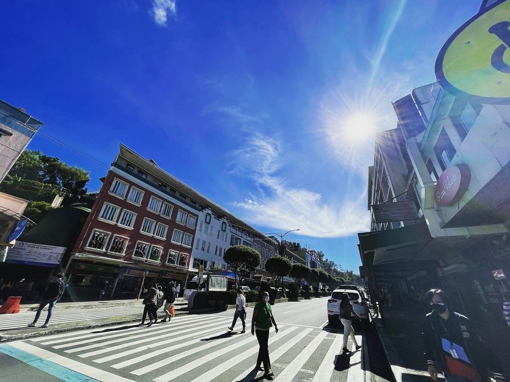 people walking on wide pedestrian road