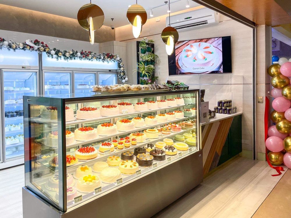 cake shop with cakes and pastries display window