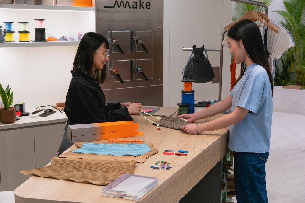 Participant learning the process of bag pleating