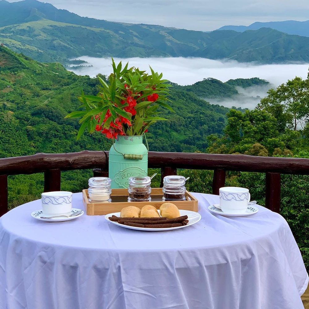 table with food overlooking mountainside