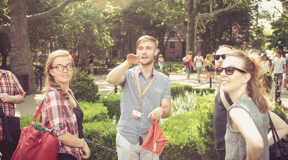 a tour group visiting washington square park in new york city usa