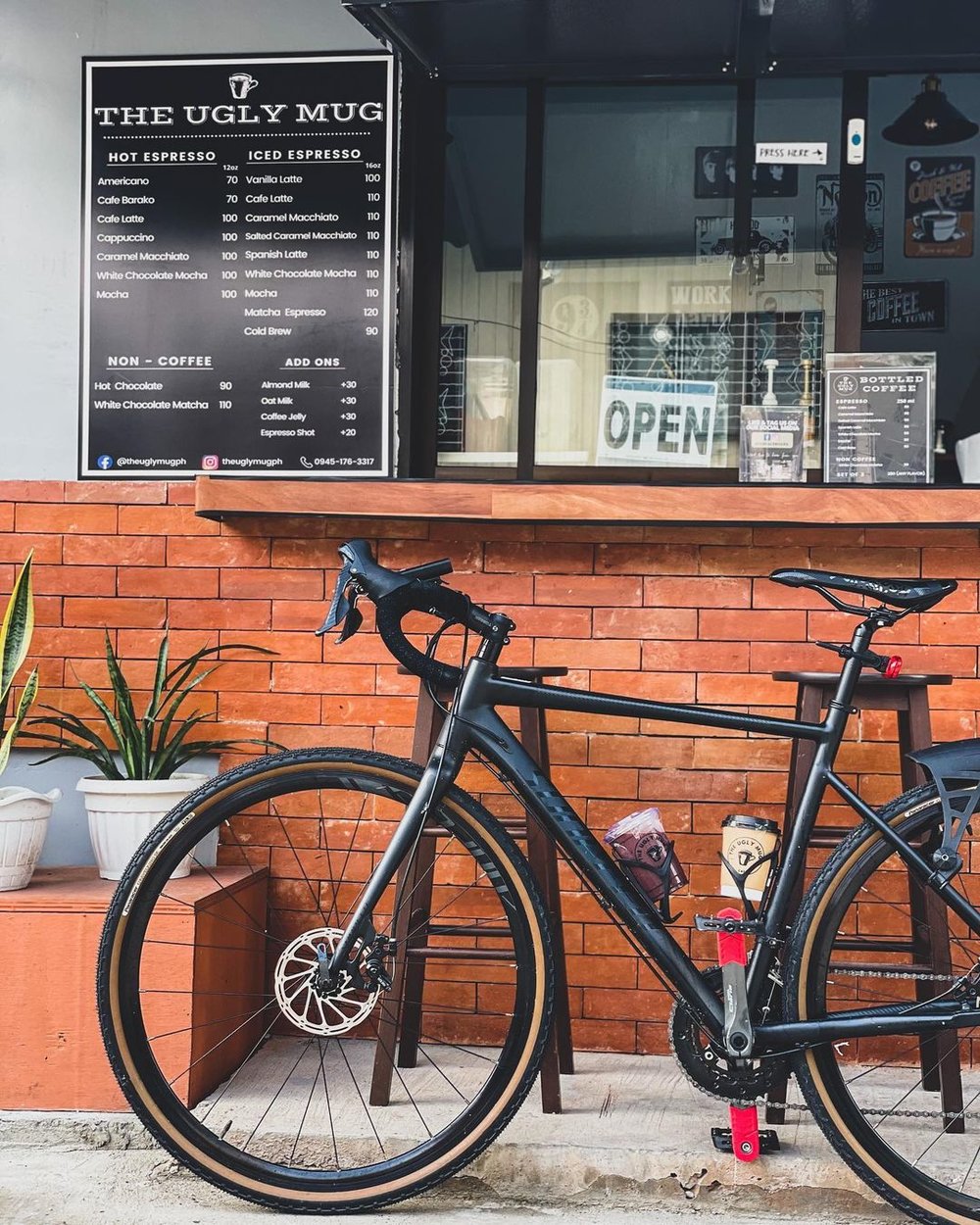 bike parked in front of a cafe