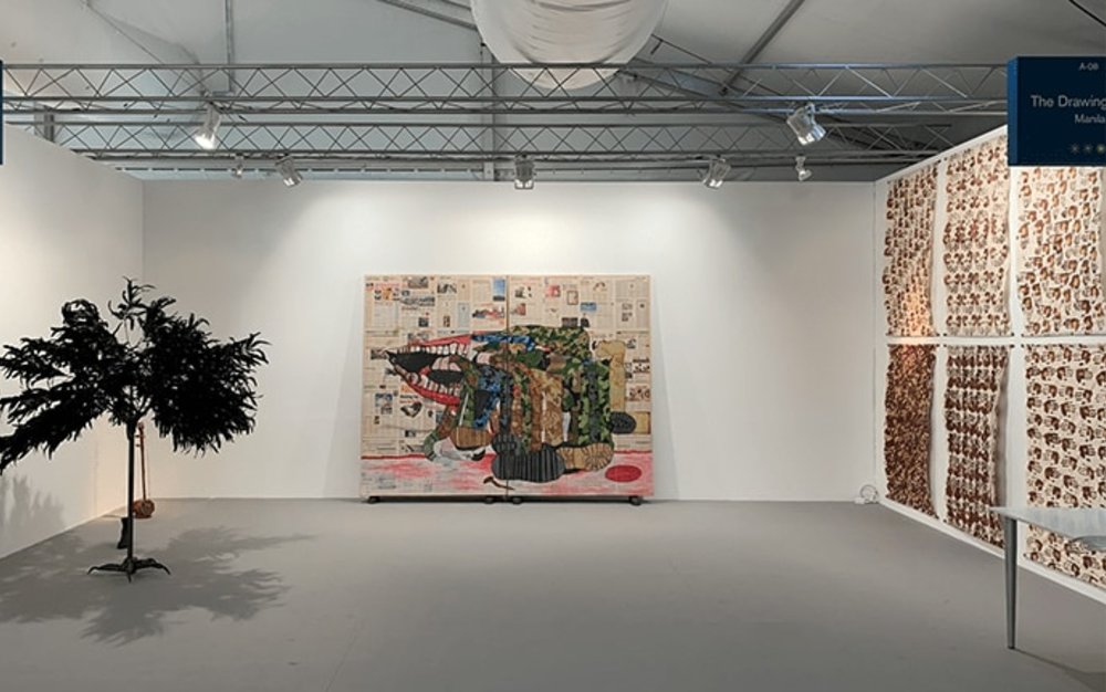 gallery wall with art installations and paintings