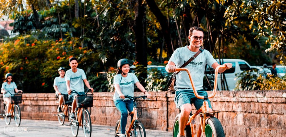 tourists riding bamboo bikes