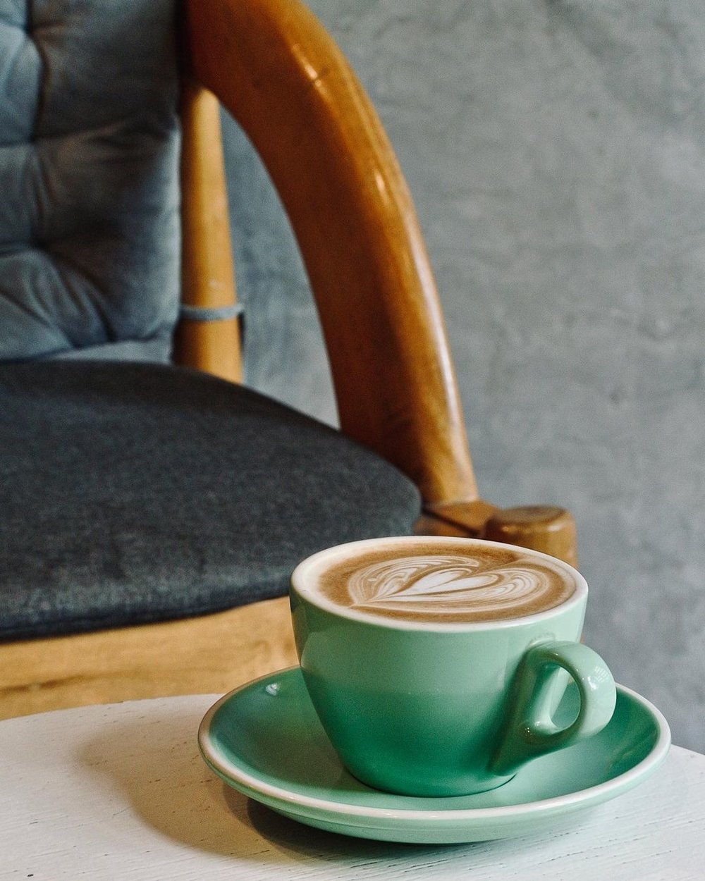 coffee mug with latte art on table