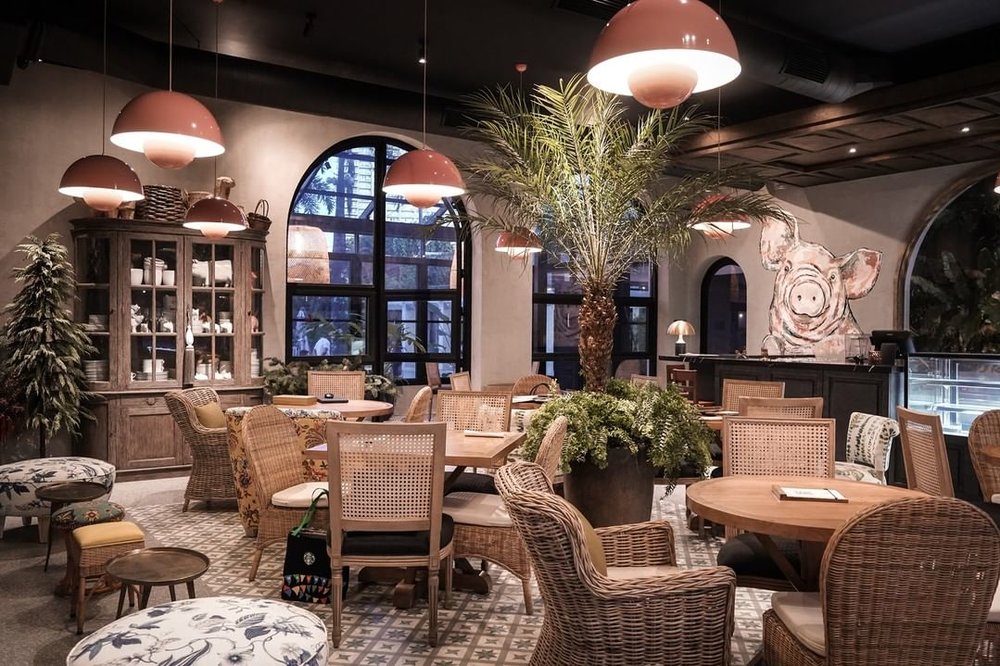 wooden tables and chairs inside restaurant