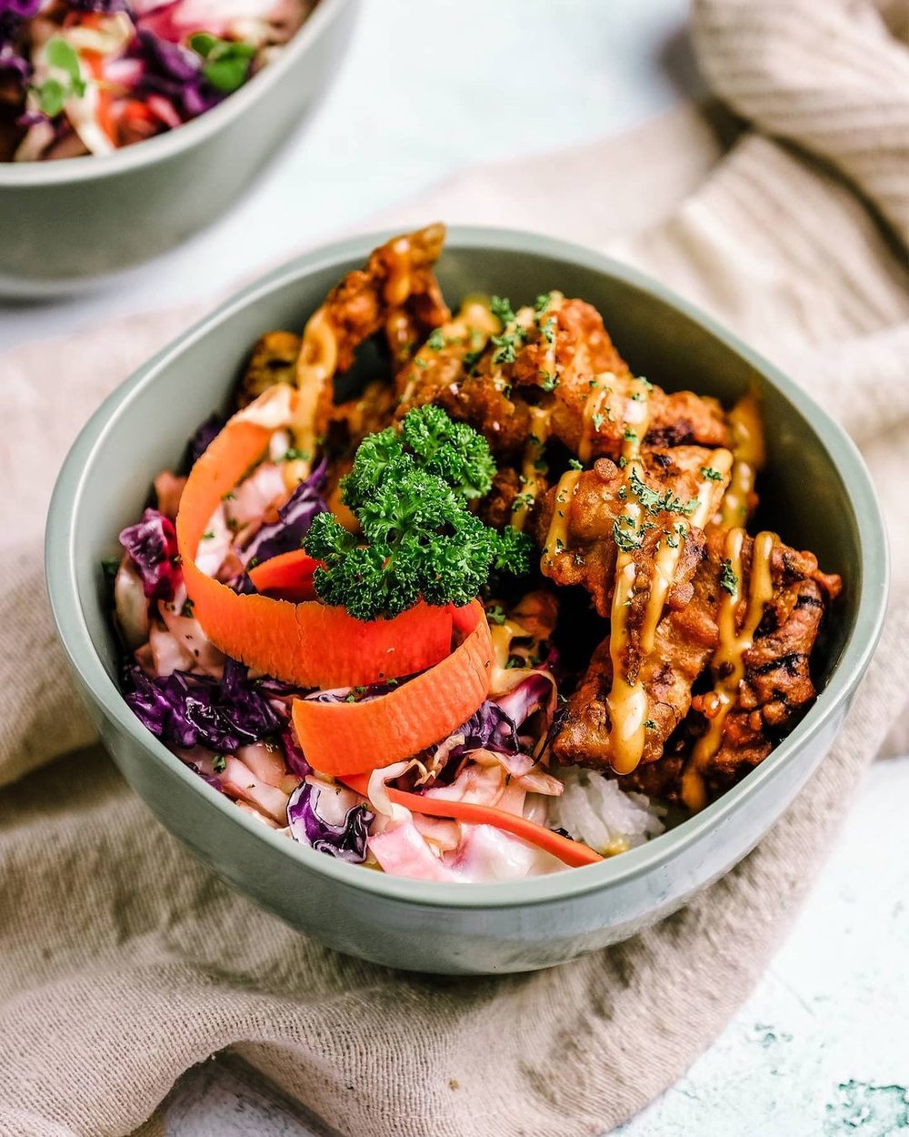 asian rice bowl with chicken and vegetables