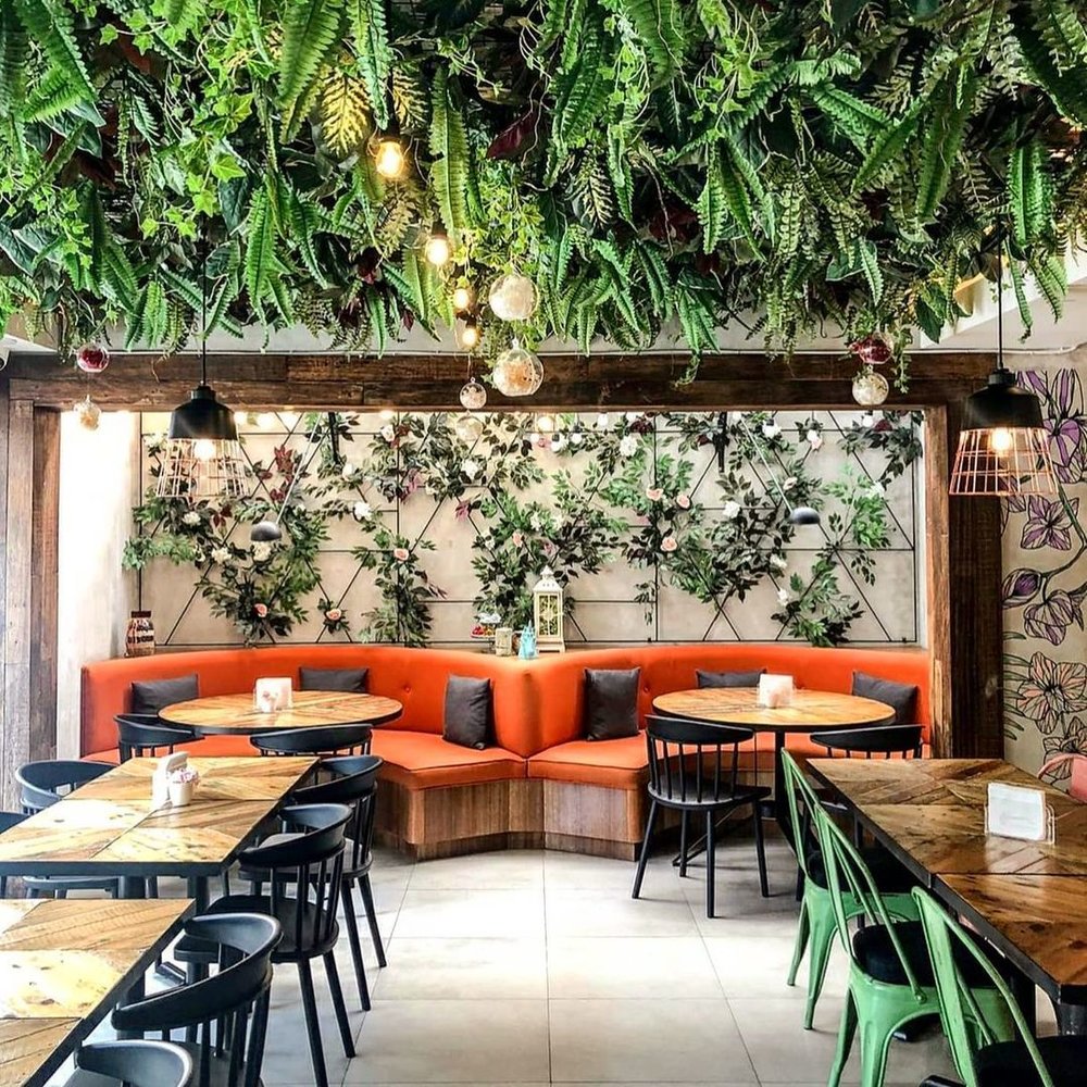 tropical designed restaurant with red booth