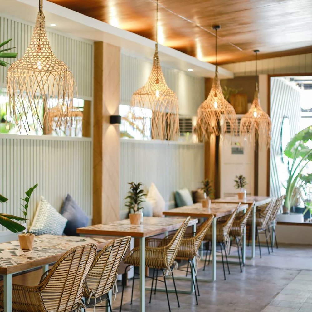 tropical restaurant with wooden chairs 
