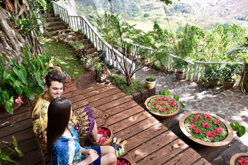 couple getting foot spa by garden