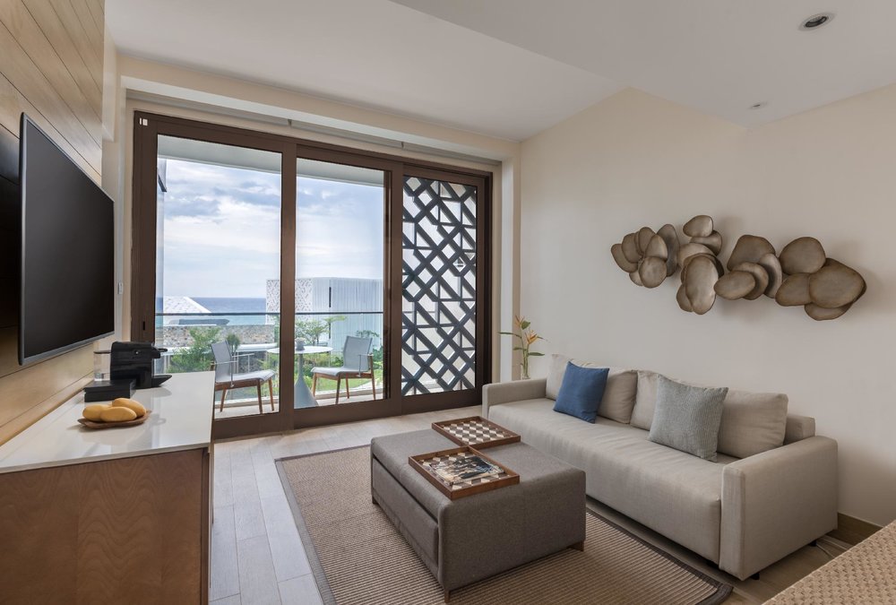 hotel suite living room with balcony