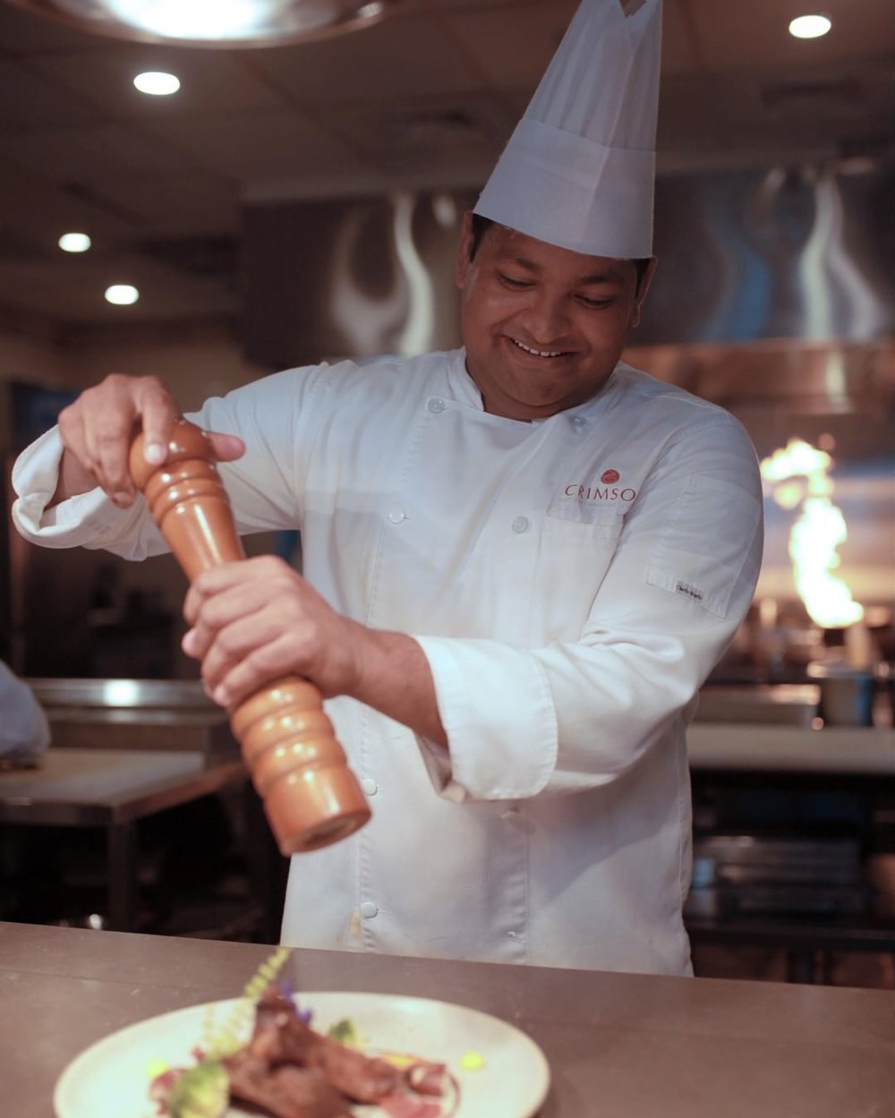 chef with pepper grinder