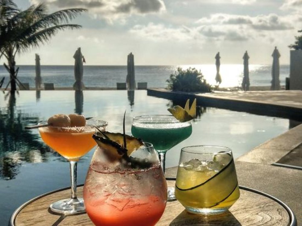 cocktail drinks in front of pool