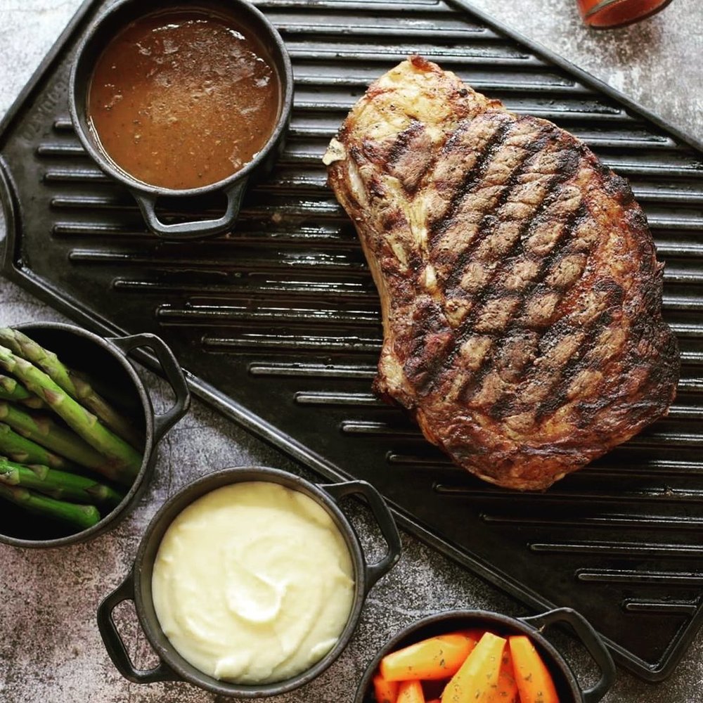 top view of steak on iron skillet