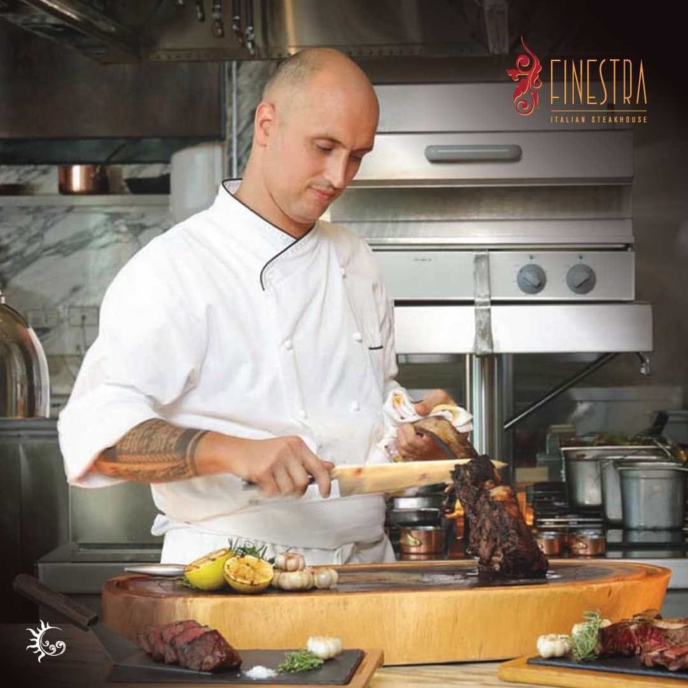 chef slicing meat from bone