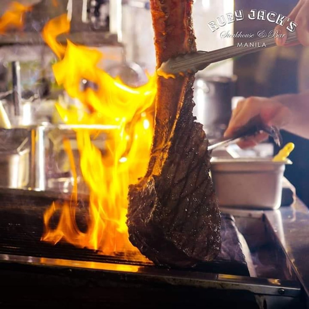 tomahawk steak cooked in fire