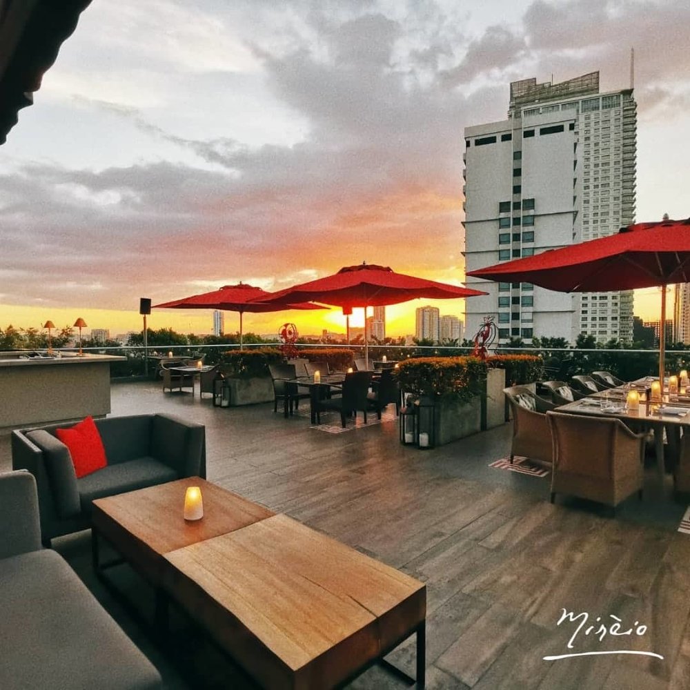 roof deck dining area during sunset