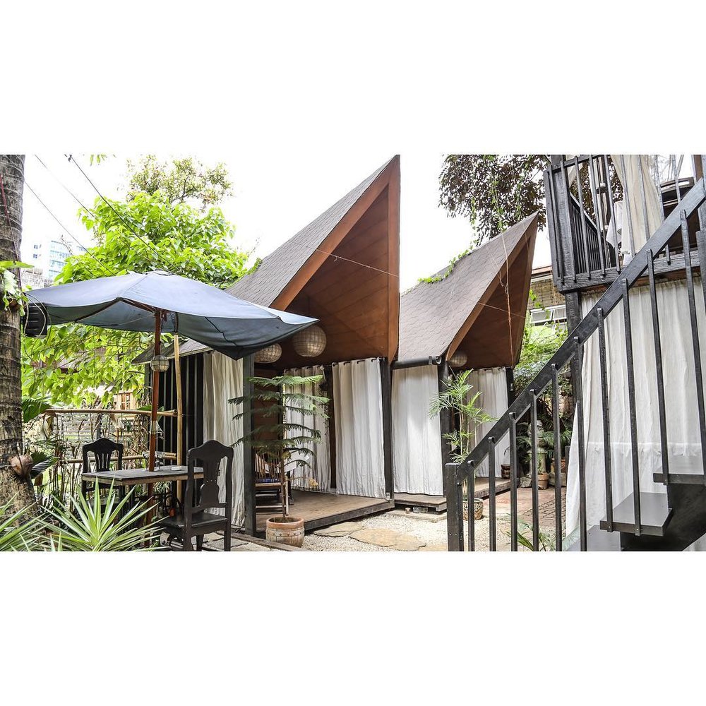 restaurant villas with wooden geometric roofs