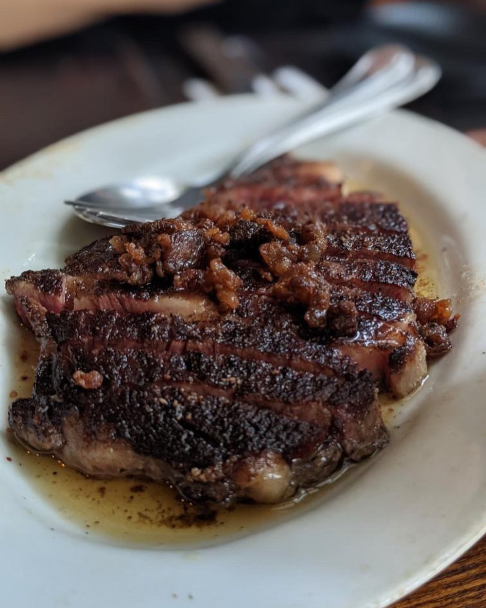 sliced steak on white plate