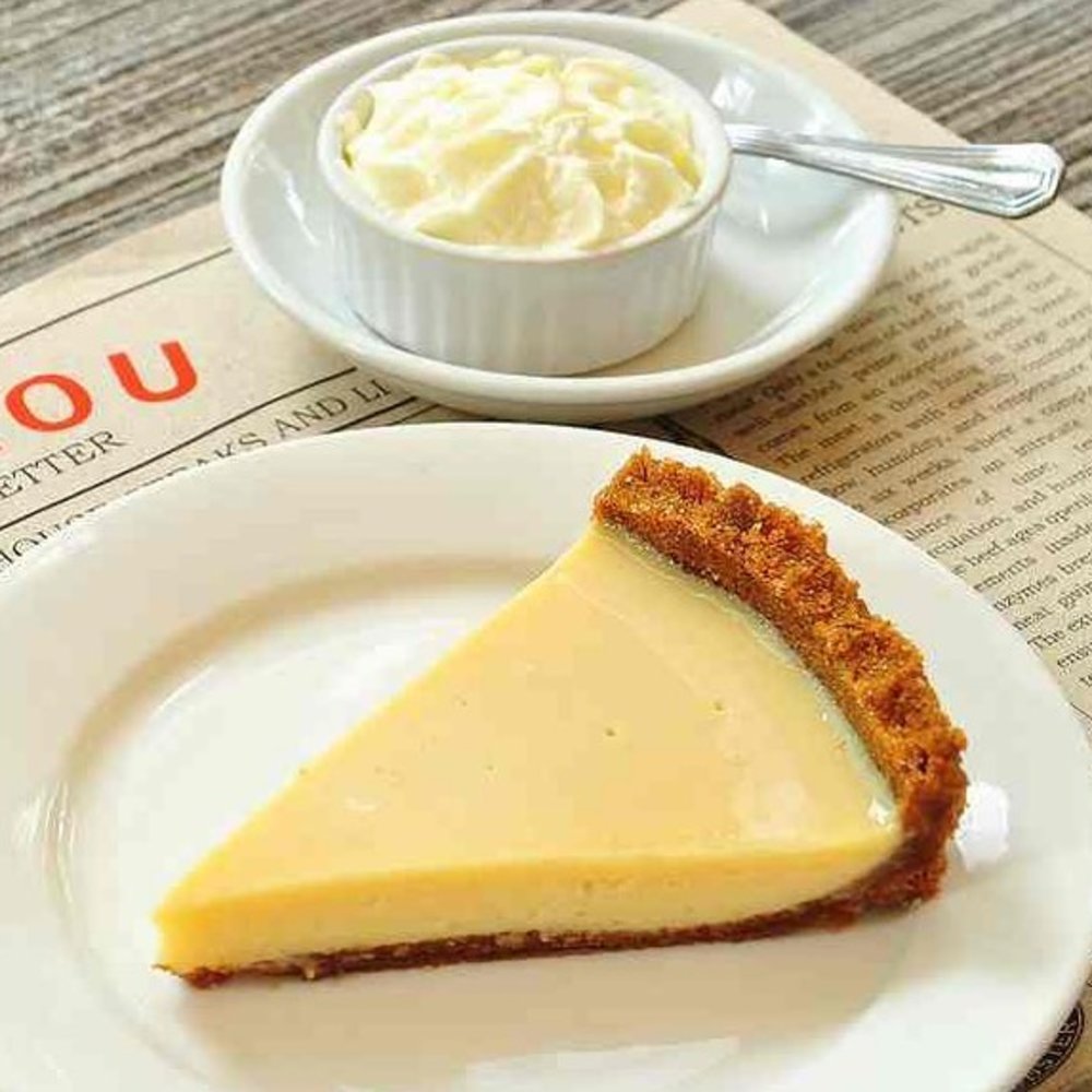 slice of pie with cream on the side