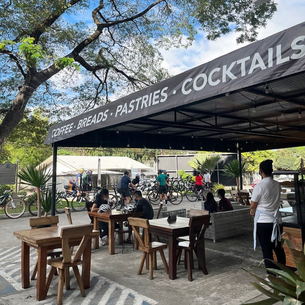 alfresco dining area with black canopy