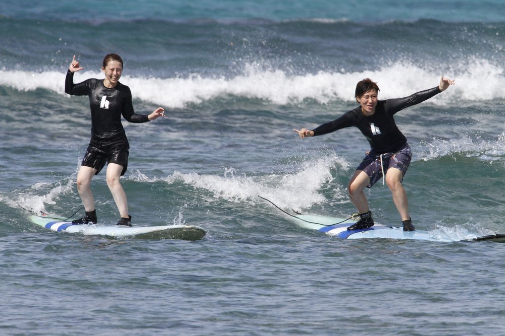Tourists learning how to surf