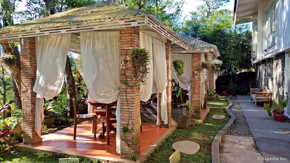 outdoor patio with white curtains