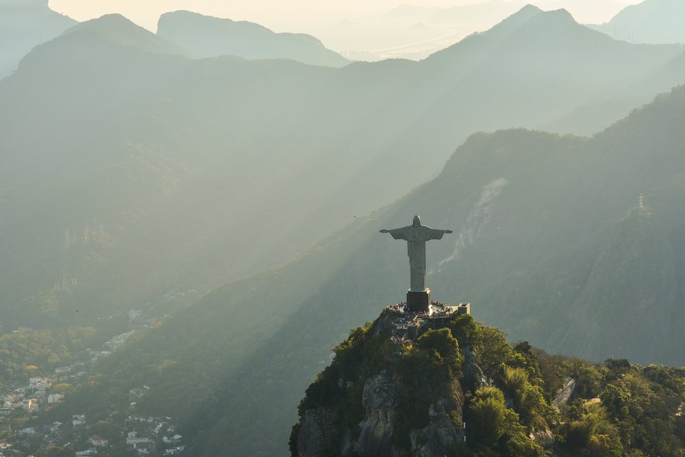 aerial shot of mountains and The Christ the Redeemer statue