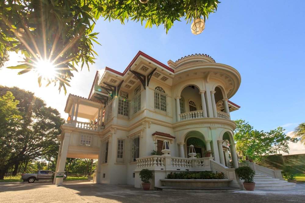 exterior of white heritage mansion