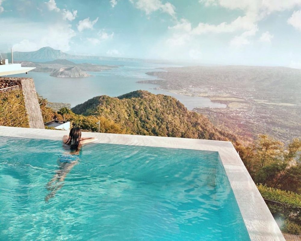 girl looking at view from infinity pool