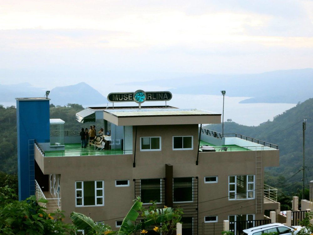drone shot of roof deck overlooking taal lake