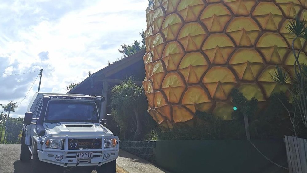 Look at how tiny the SUV is next to the Big Pineapple Image Credits: @stretched_lc79