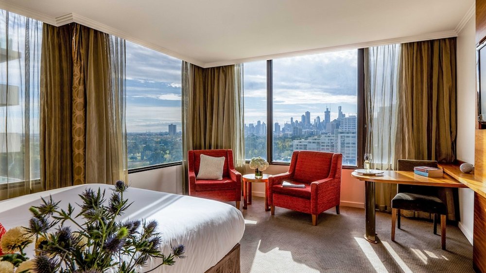 Step back, relax, and take in the views in your spacious room at View Melbourne.
