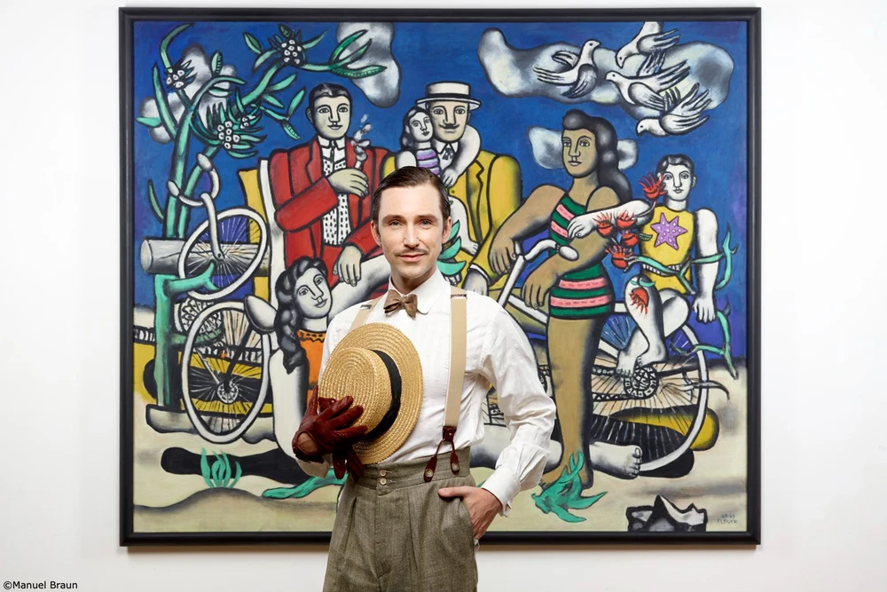 a man in front of a painting at paris' the pompidou center