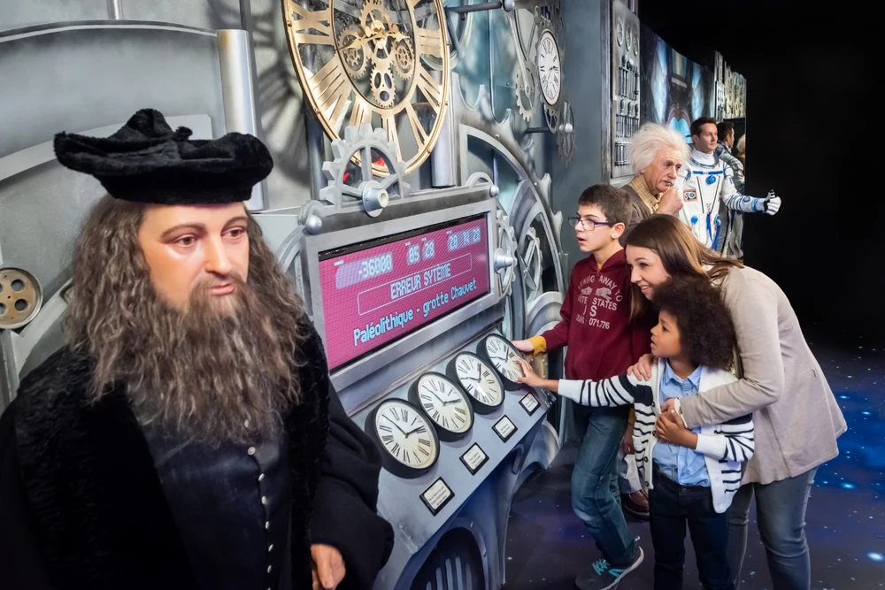 children interacting with exhibits at paris' grevin wax museum