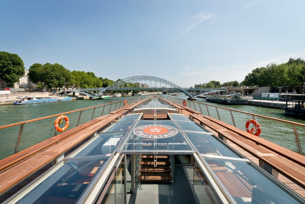 a boat gliding along the river seine in paris
